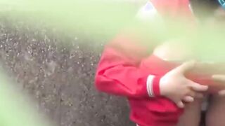 Short haired Japanese babe in tracksuit pees in the street