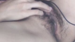 Beautiful Japanese teen playing with her hairy pussy
