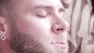 Tattooed bearded hunk strokes his huge rock hard dick