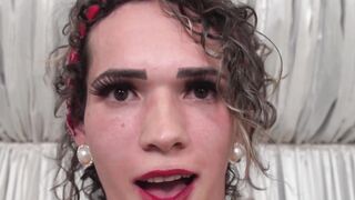 Busty shemale in sexy fishnets works on her cock hard