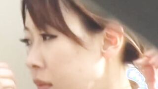 Japanese chick rubs herself outside before furtively peeing