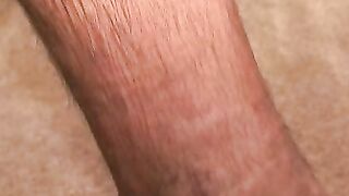 Hairy mature guy pulls out his dick on the sofa and comes