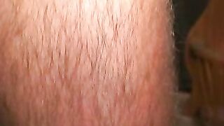 Hairy mature guy pulls out his dick on the sofa and comes