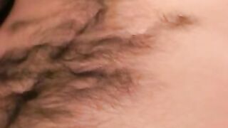 Hairy mature guy pulls out his dick on the sofa and comes