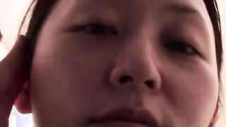 Japanese cutie fills a cup up with her pee and records it