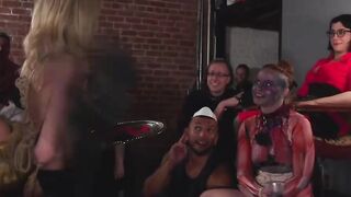 Submissive slaves are flogged and fucked at Halloween party