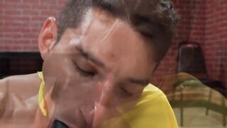 Jockstrapped lad sucks and plays with enormous dildos