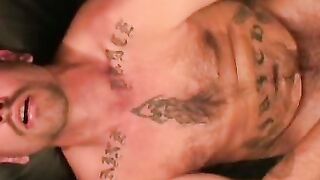 Tattooed mature given a blowjob and anal fingering