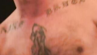 Tattooed mature given a blowjob and anal fingering