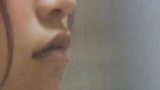 Young Japanese babe filmed fingering pussy in secret