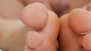 Young blond jock touches his feet while masturbating solo