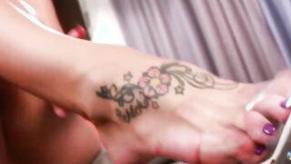 Seductive tranny shows off feet before masturbating wildly