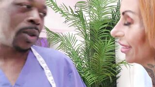 AGEDLOVE A doctor with the BBC examines a busty woman