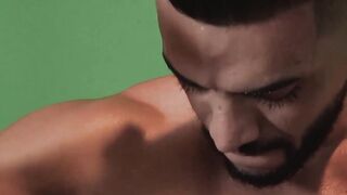 Alluring gay stud shows his muscles and strokes his dick