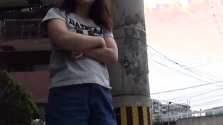 Teen Asian redhead shot while peeing in the city