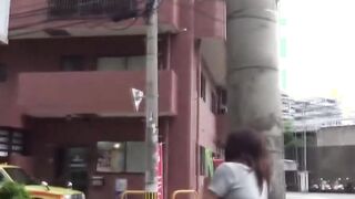 Teen Asian redhead shot while peeing in the city