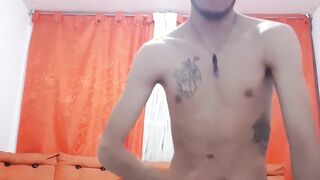 Inked Latino twink jerks off solo for a popping cumshot