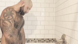 Atlas Grant shows off that bear body and tugs on his dick
