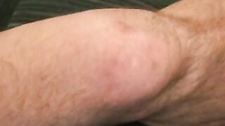 Older hairy guy masturbates using two hands on his big dick