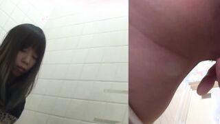 Naughty Japanese babe fingers her pussy in public toilet