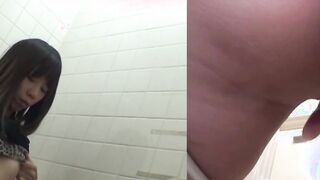 Naughty Japanese babe fingers her pussy in public toilet