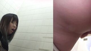 Naughty Japanese babe fingers her pussy in public toilet