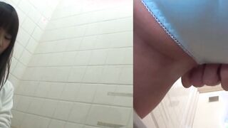 Naughty Japanese babe fingers her pussy in public toilet