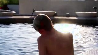 Near the pool blonde twink Tyler Thayer jerks his cock