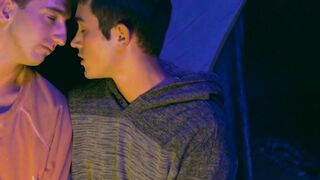 Lively stepbrother beat crude before a setting up camp fire
