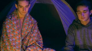 Lively stepbrother beat crude before a setting up camp fire