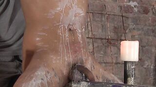 Beautiful young sub endures hot wax and strong handjob