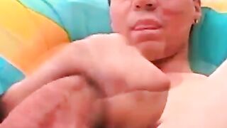 Beautiful young man tugging and stroking his hard cock