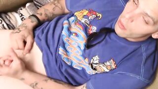 Tattooed straight thug plays with his small dick and cums