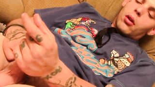 Tattooed straight thug plays with his small dick and cums