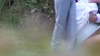 Japanese cutie caught on cam sucking and riding cock outside