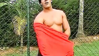 Horny Brazilian muscle head yanking off his pounding dick outside