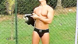 Horny Brazilian muscle head yanking off his pounding dick outside