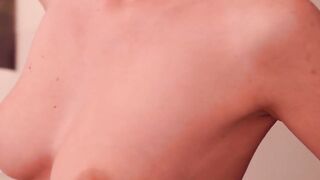 To tease you a woman with a ponytail moves around naked