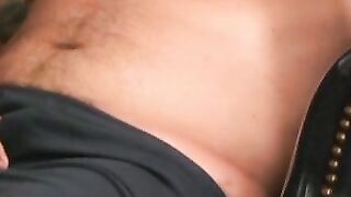 Tattooed dude tugging on his cock until he cums on his belly