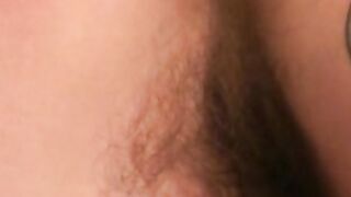 Tattooed dude tugging on his cock until he cums on his belly