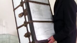 Fetish chick locked inside a box having sex before getting a facial