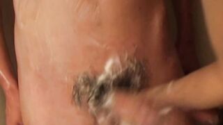 Young Japanese twinks wash and suck each others cock
