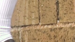 Japanese schoolgirl touching herself before peeing outside