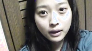 Delightful Japanese chick sits on the latrine and pees in a cup