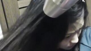 Delightful Japanese chick sits on the latrine and pees in a cup