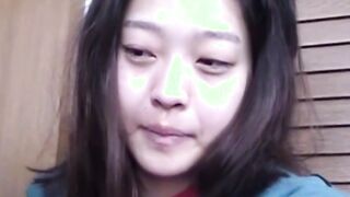 Delightful Japanese chick sits on the latrine and pees in a cup