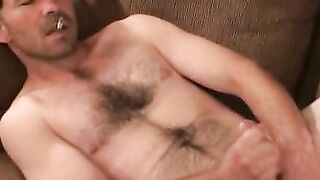 Mature guy shows off his hairy body and tugs on his big cock