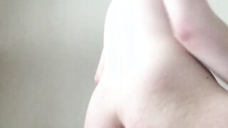 Young homosexual guy grabs his big cock and a butt plug
