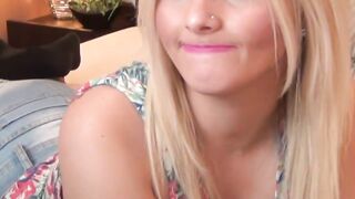 Hot blonde in jeans shorts in bed posing on webcam