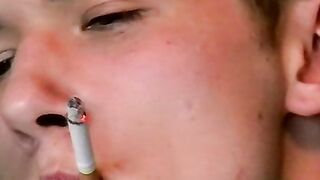 Hot dude stroking his huge dick and enjoys smoking butts